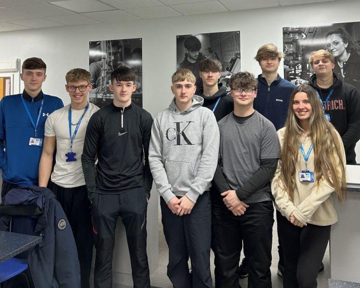 Engineering students stood together for a group picture in classroom