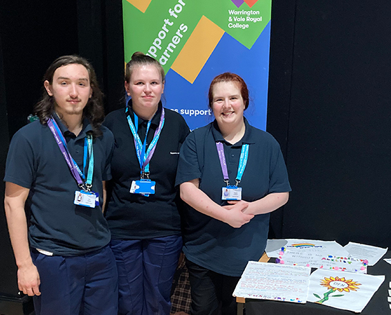 Supported internship students at an information stall