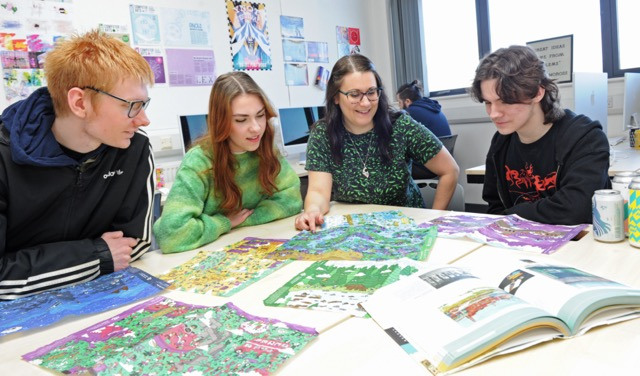 ACDS Graphics students looking at artwork