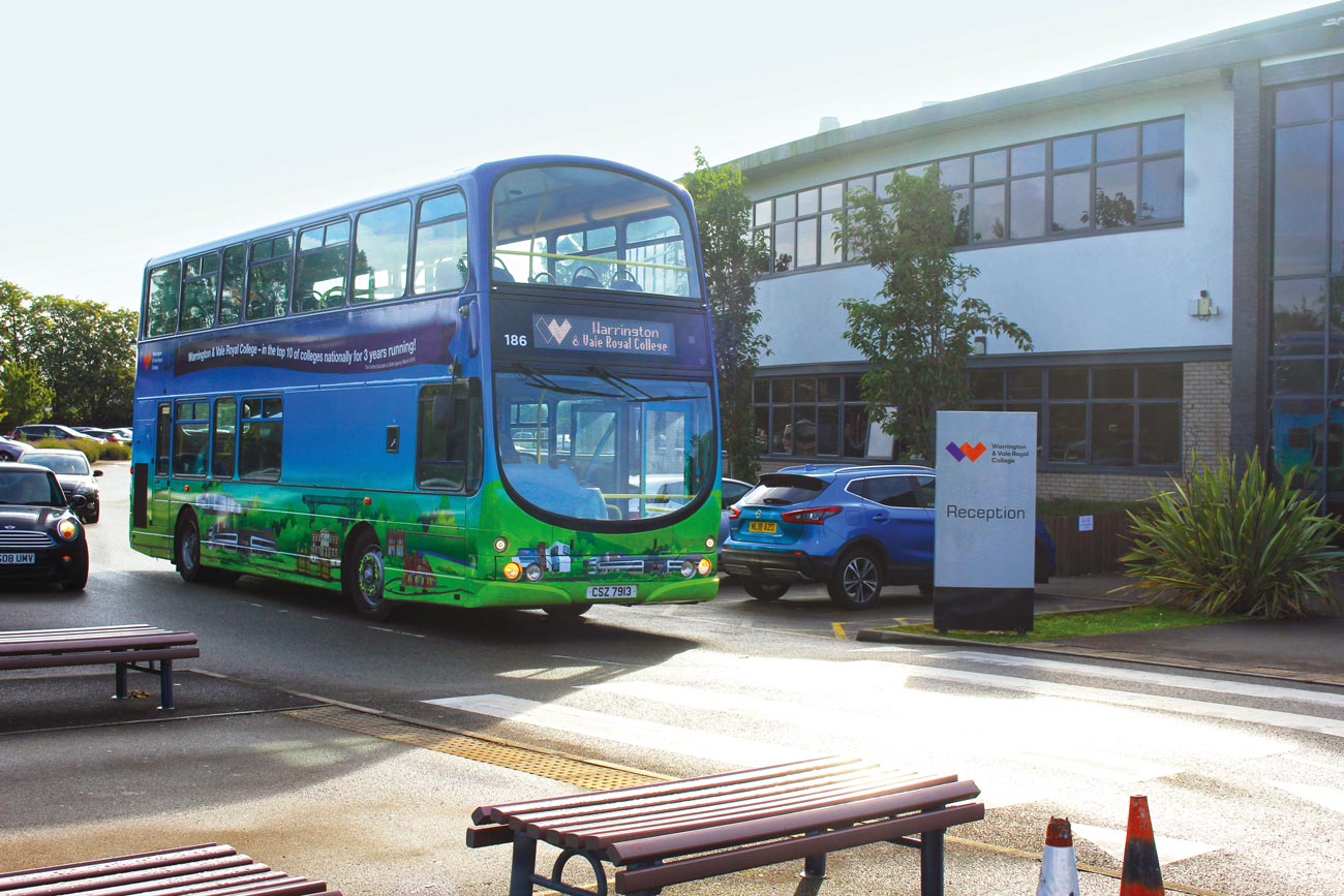Bus parked outside of Warrington campus main building jpg
