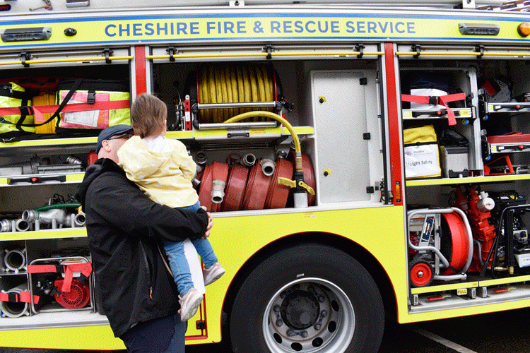 Child looking at fire engine