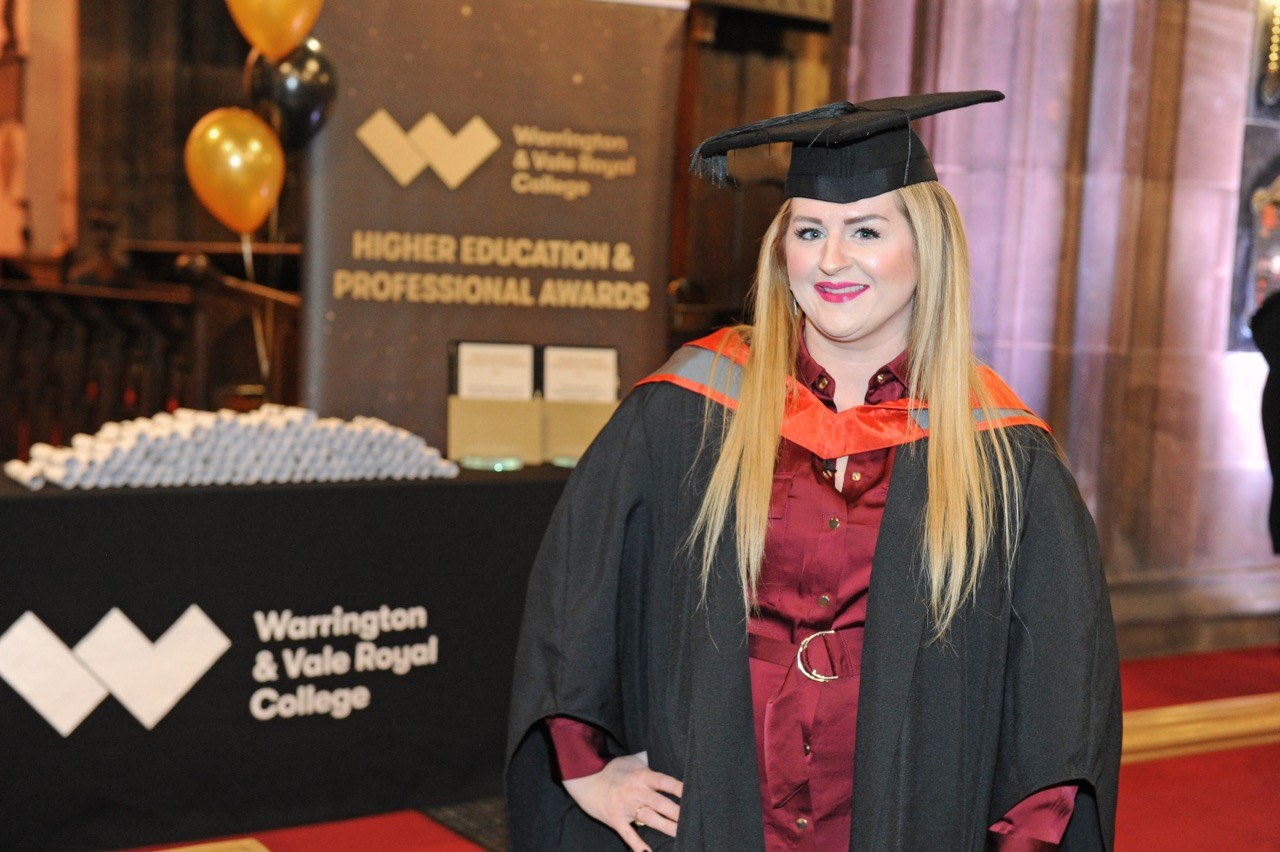 Female graduate posing for camera