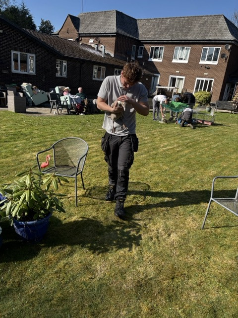 Student carrying duck