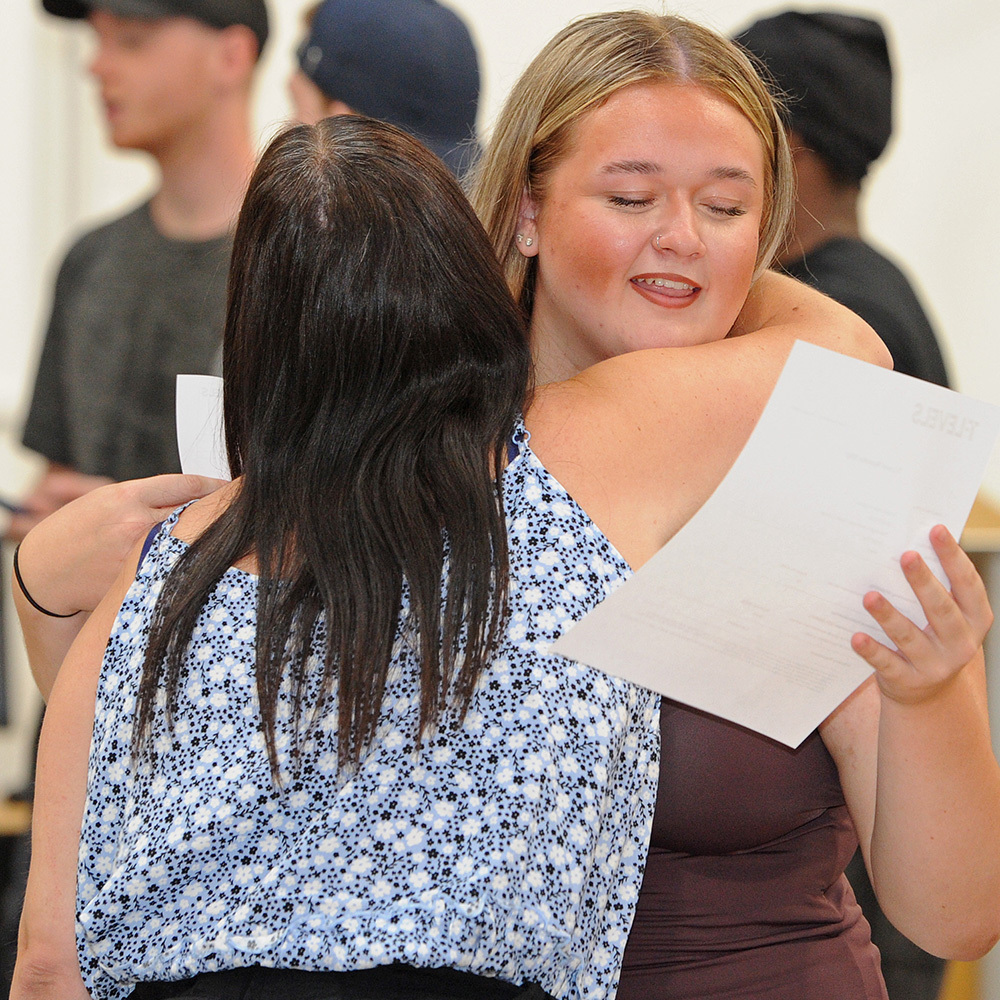 Mum and daughter hug after receiving results
