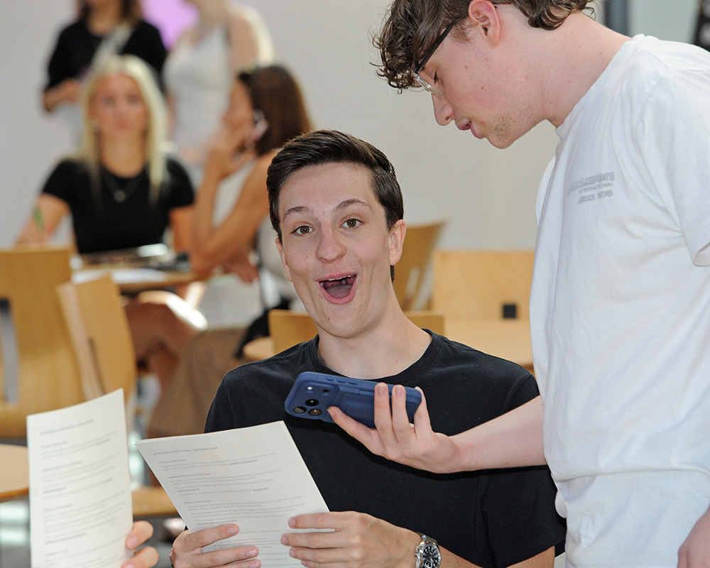 Overjoyed student looks at his results