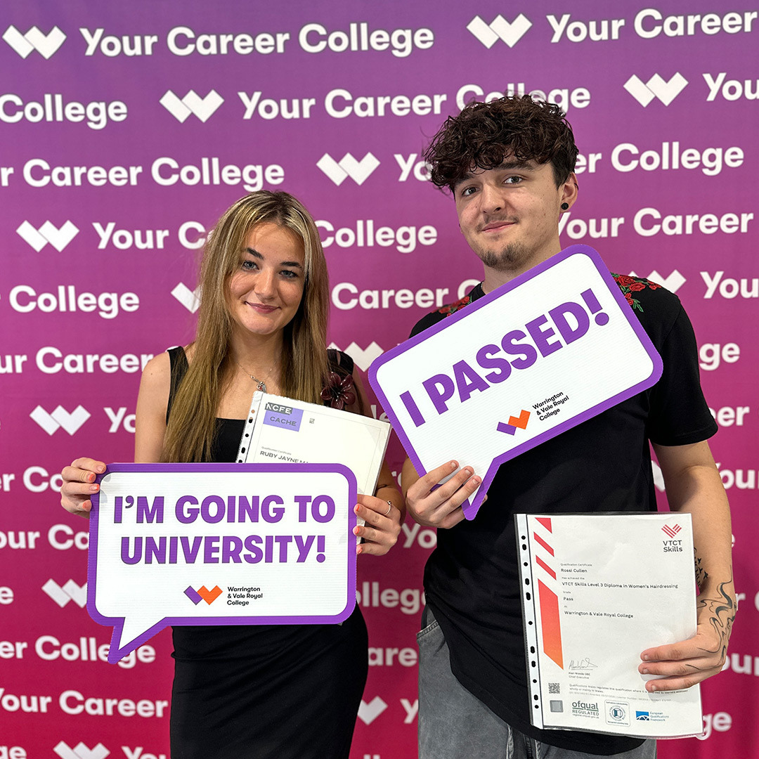 Pleased students hold up signs with their destinations on them
