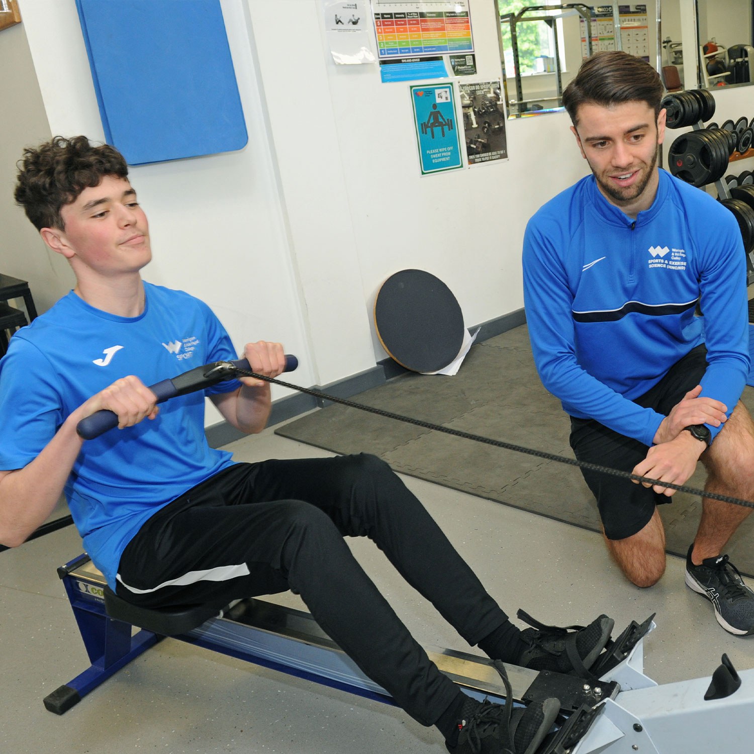 Sport student using rowing machine