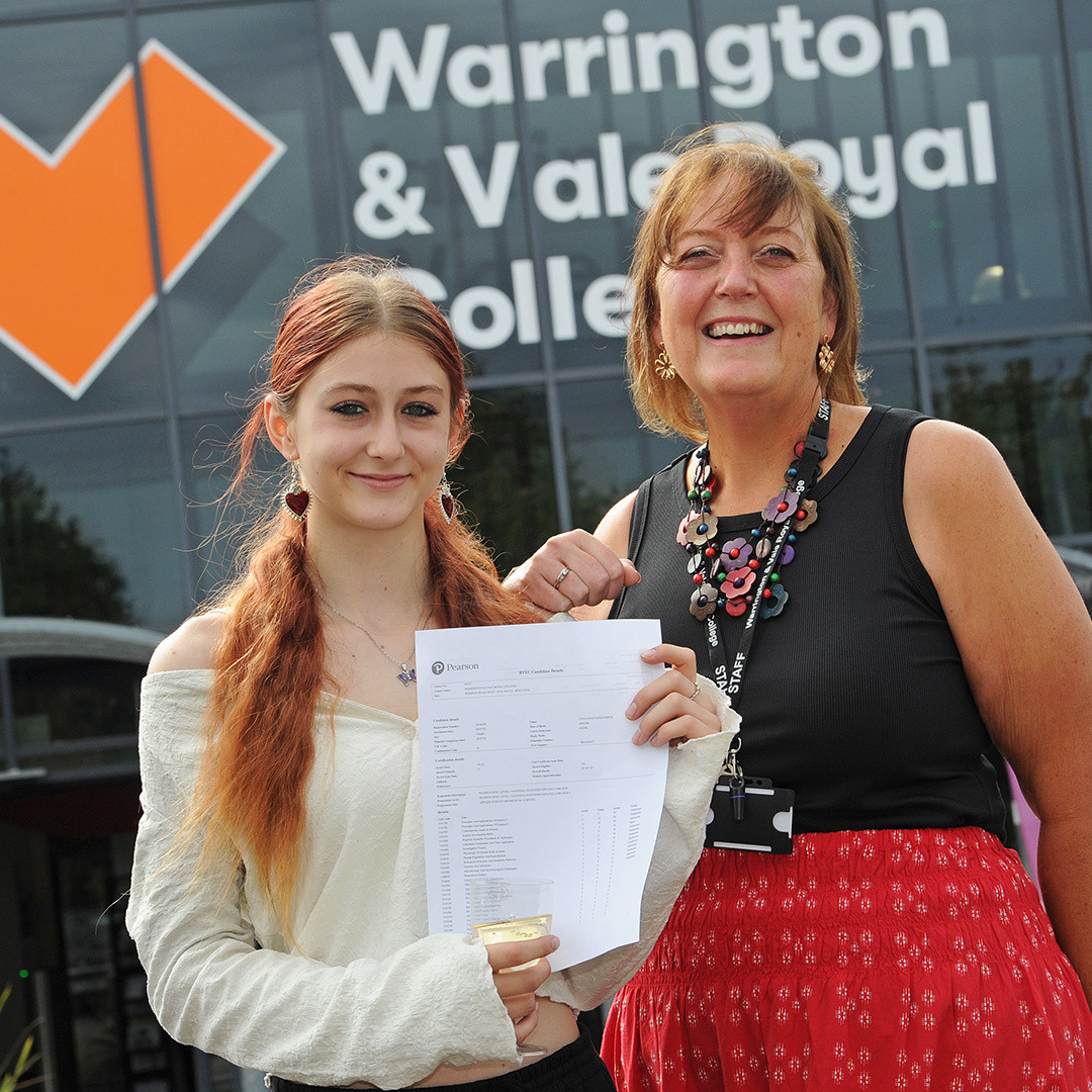 Student and her tutor celebrate her triple distinctionstar grade