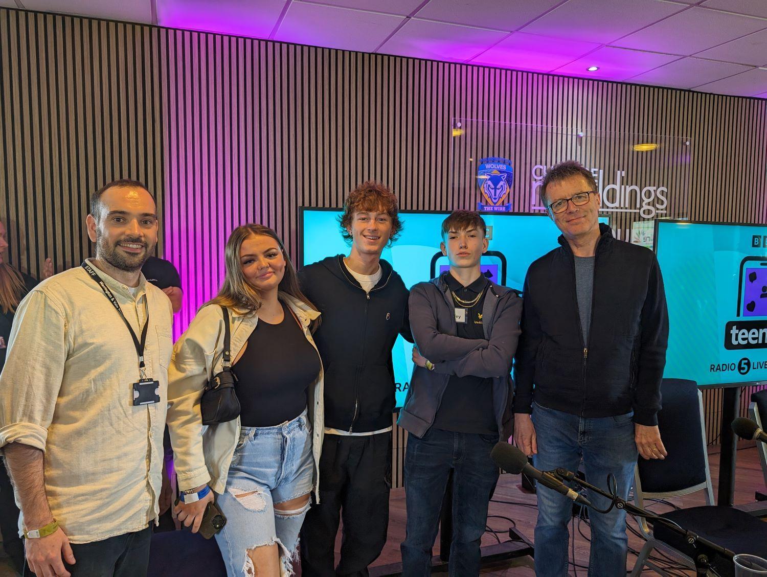 Students Cassian Harley and Molly with tutor Phil and Nicky Cambell on set