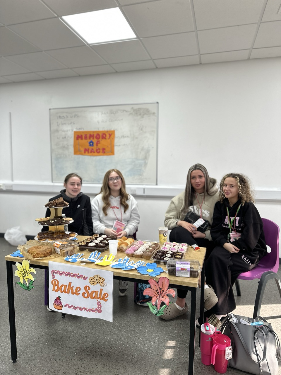 Students at the bake sale stand