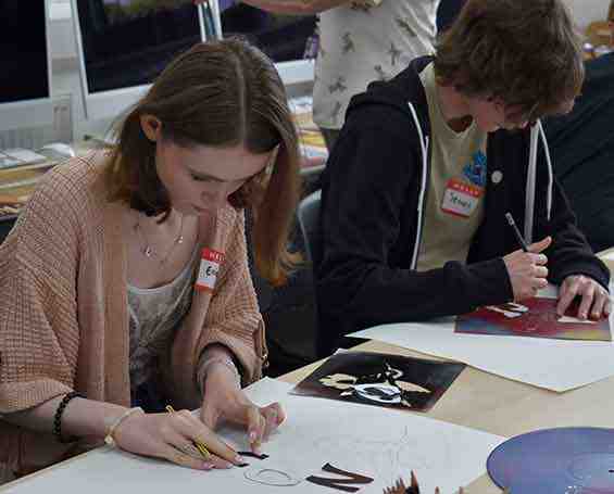 Students enjoying graphic design class