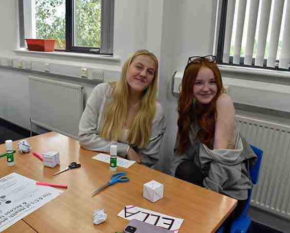 Students smiling in childcare class