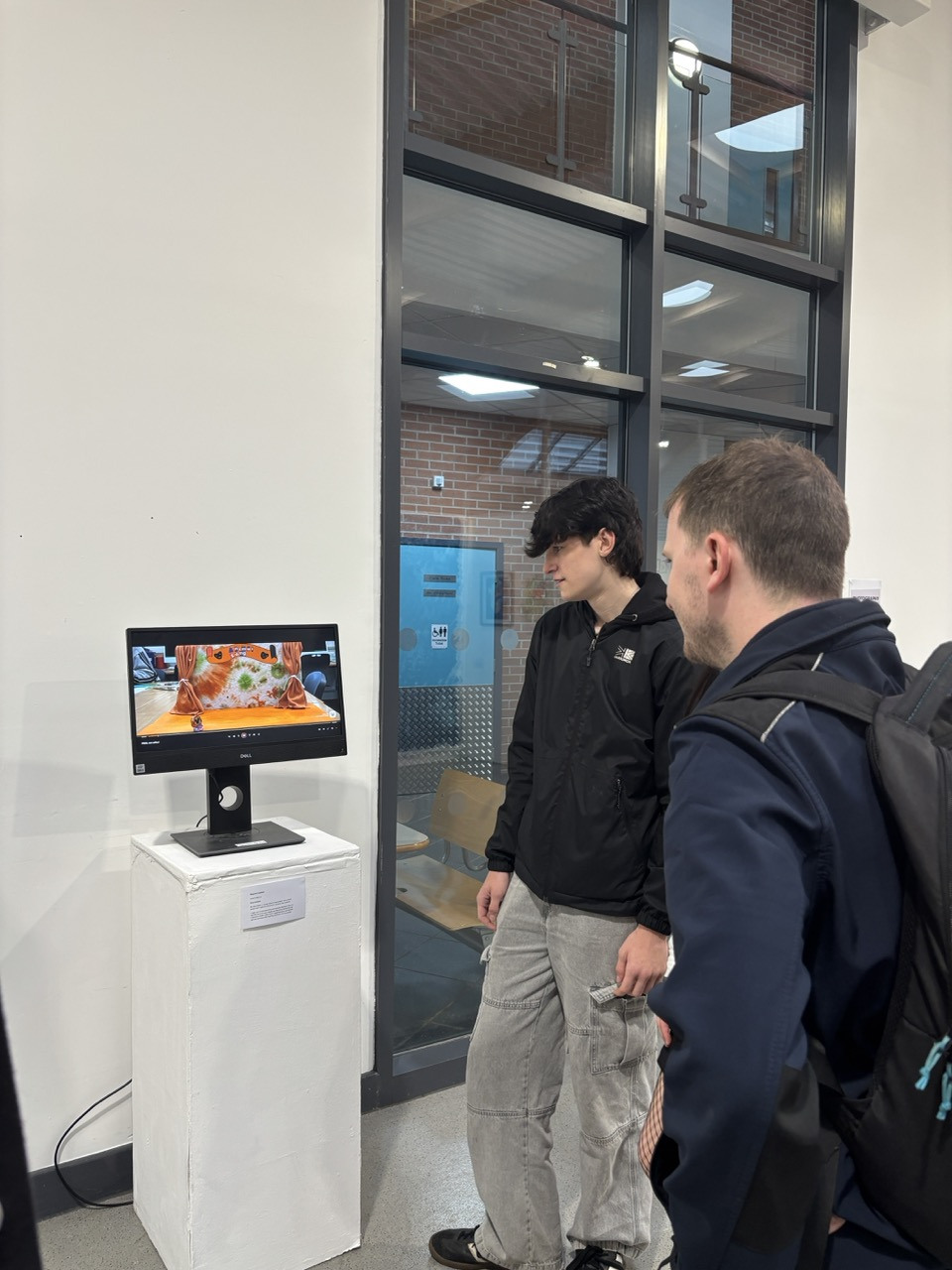 Students watching stop animation End of Year Art Exhibtion Large