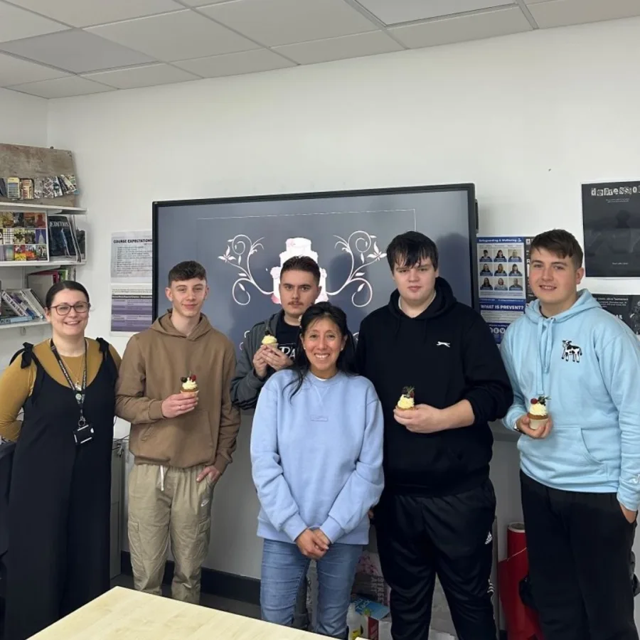 Graphic design students standing with Jessica