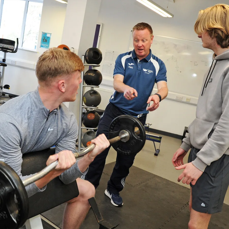 Sport student using weights