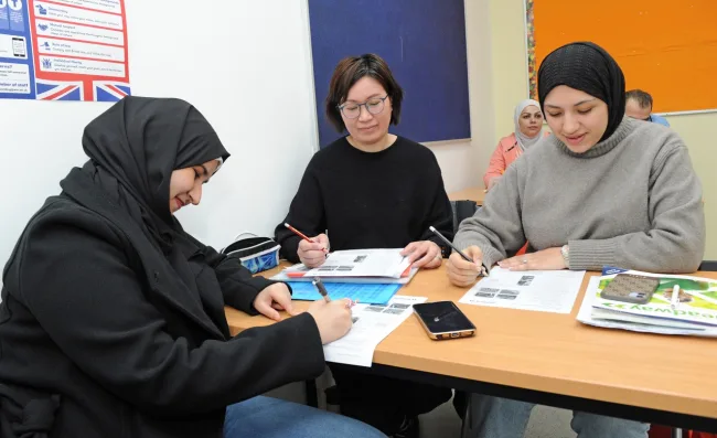 ESOL students having group discussion in classsroom