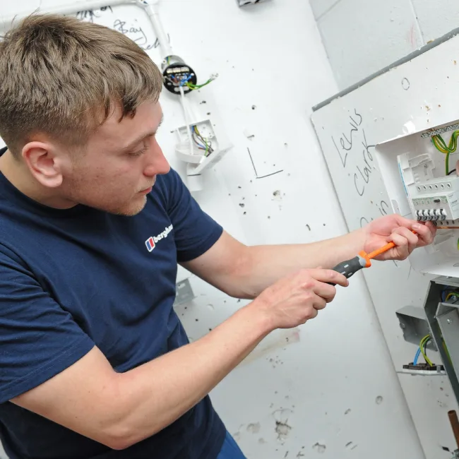 Adult Apprentice working with wires