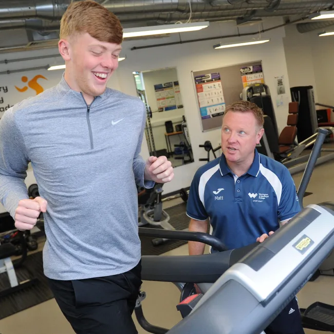 Adult sport student using exercise bike