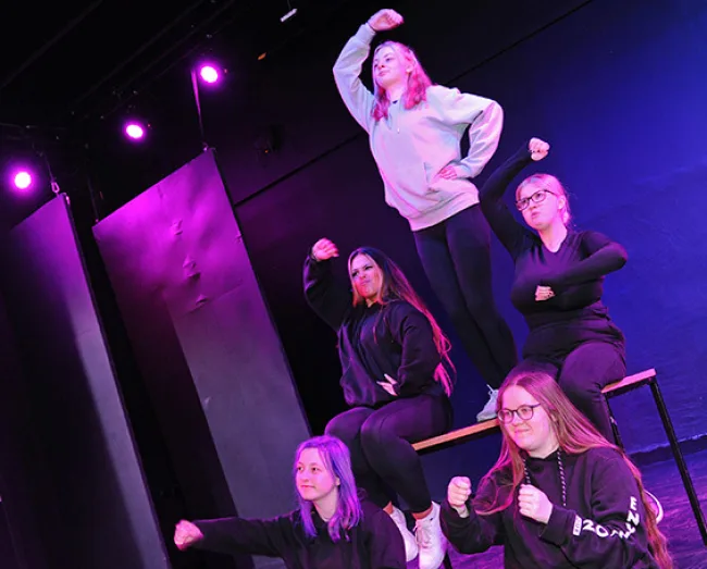 Students performing on stage