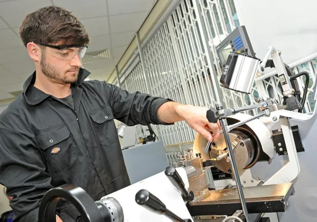 Engineering student using equipment
