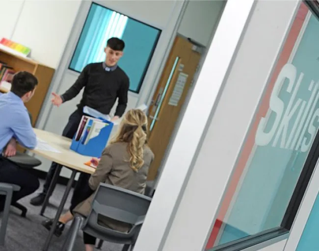 Smart young man delivering a presentation