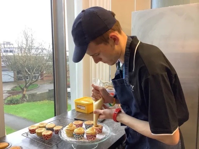 Foundation Learning student decorating cakes