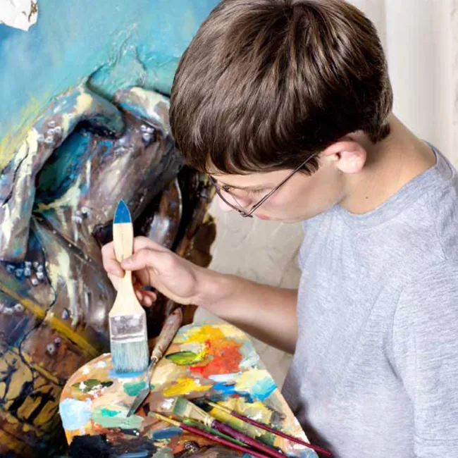 Foundation Learning student painting a canvas