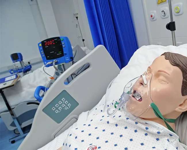 Health Social Care Academy mannequin in hospital ward