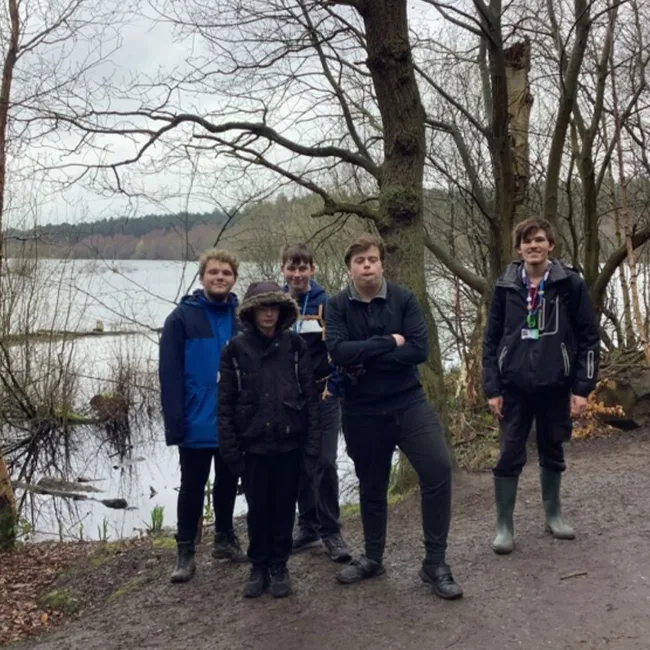 Foundation learning students on a trip in the woods