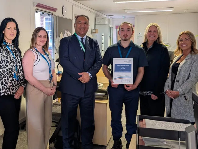 Lee Smith receiving the Chief Executive Award from CEO and supervisors