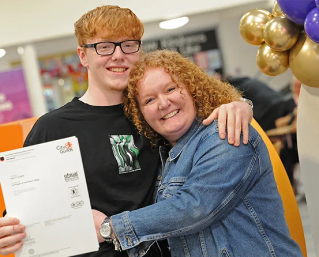 Bricklaying student and his mum celebrate his achievement of vocational results day