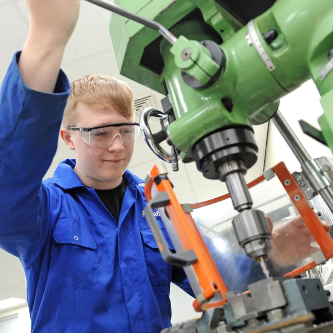 Engineering student using equipment